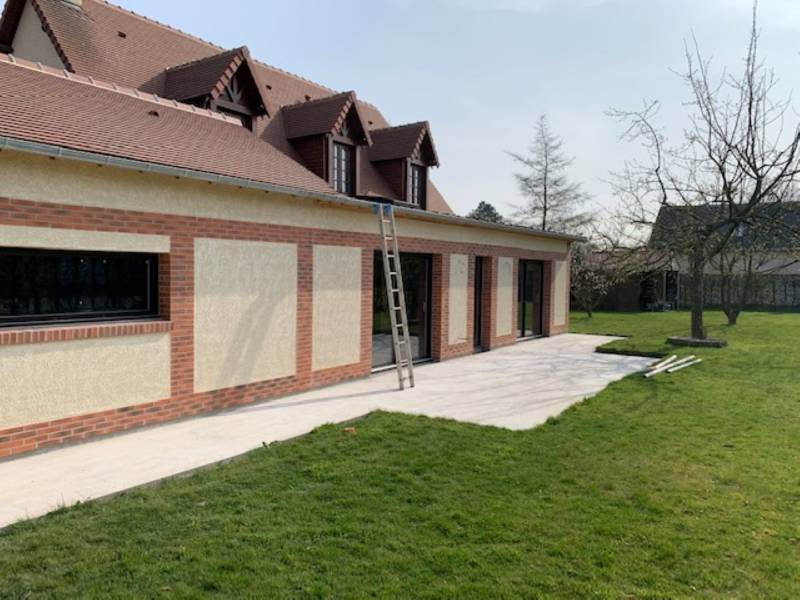 Agrandissement avec un style authentique à la maison individuelle à Terres de Caux